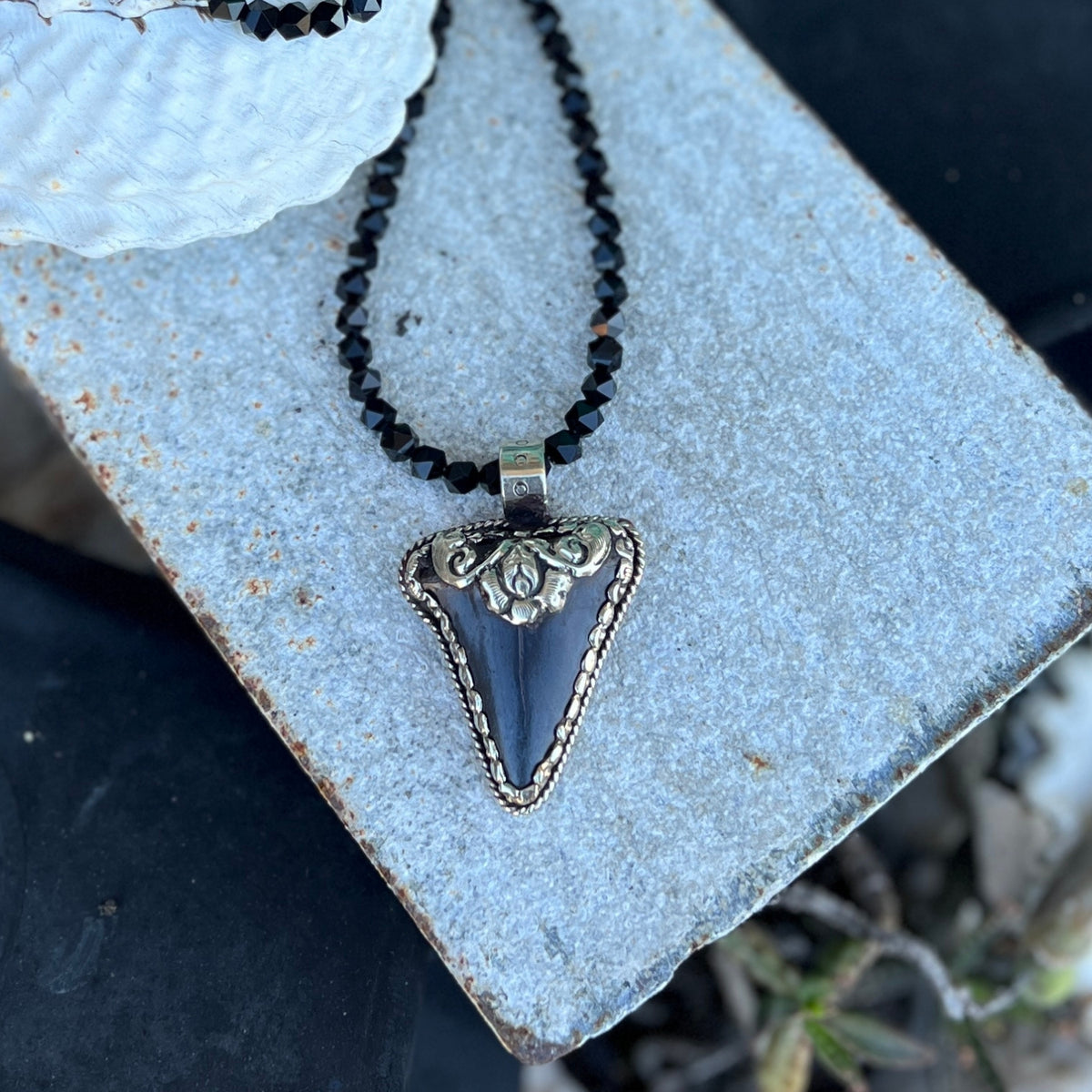 This Megalodon Shark Tooth Necklace is for the adrenaline hunters and shark lovers—anyone who understands that apex predators don't apologize for their power.
