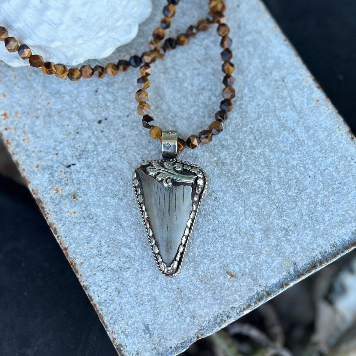 This Megalodon Shark Tooth Necklace is for the adrenaline hunters and shark lovers—anyone who understands that apex predators don't apologize for their power.