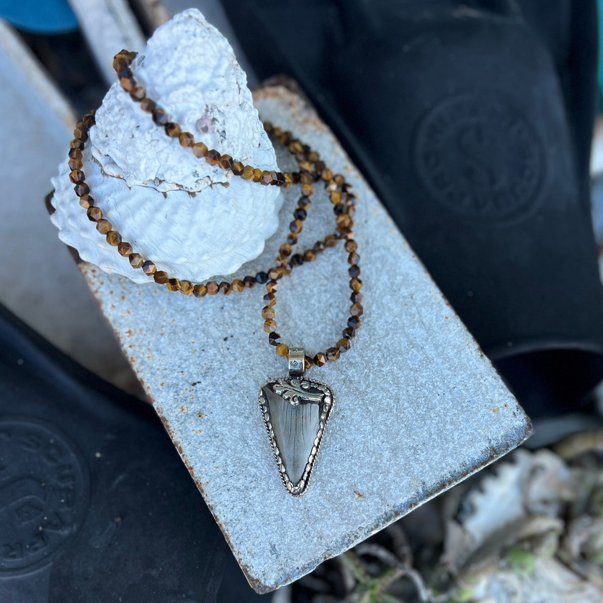 This Megalodon Shark Tooth Necklace is for the adrenaline hunters and shark lovers—anyone who understands that apex predators don't apologize for their power.