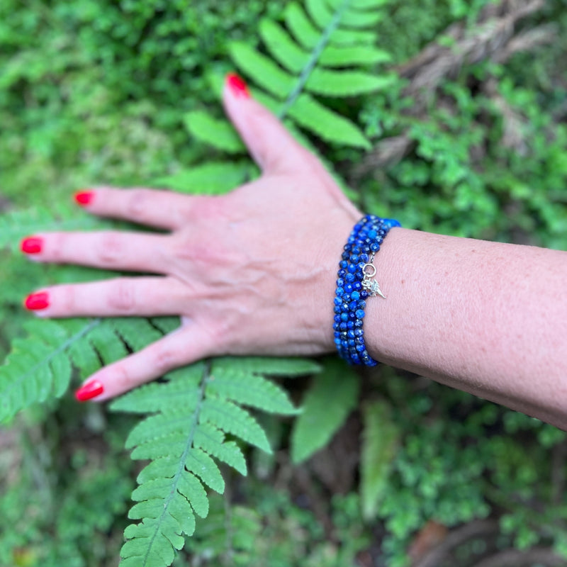 The Ocean Treasures Wrap Bracelet features stunning blue Lapis Lazuli stones that evoke the calming and peaceful essence of the ocean. Adding to the charm of the bracelet is the tiny silver dipped Shark Tooth charm. The Shark Tooth is a symbol of strength and resilience. Perfect for the Adrenaline Hunters and Shark Lovers