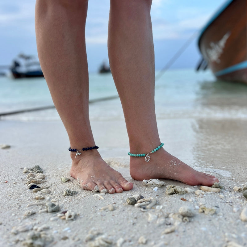 Slip on the Dolphin Spirit Anklet and let the magic of the beach accompany you wherever you roam. It's a symbol of your love for the sea and your carefree, barefoot soul.