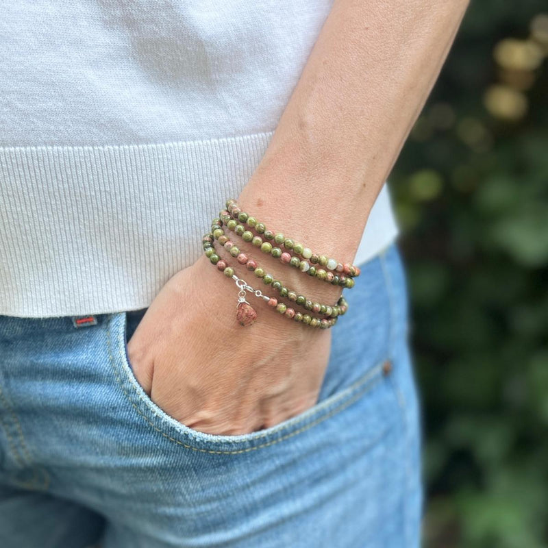 Experience the harmonious connections and deep healing energies of our Unakite Harmony Wrap Bracelet. Crafted from the beautiful Unakite gemstone, this bracelet combines the soothing vitality of greens with the affection and empathy of pinks, creating a powerful fusion of energies.