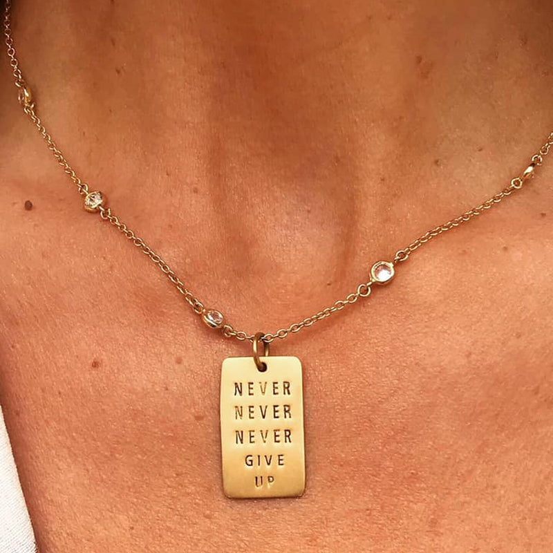 Lu Parker from KTLA wears Never Give Up Gold Filled Dog Tag Necklace w/ Rainbow Crystals