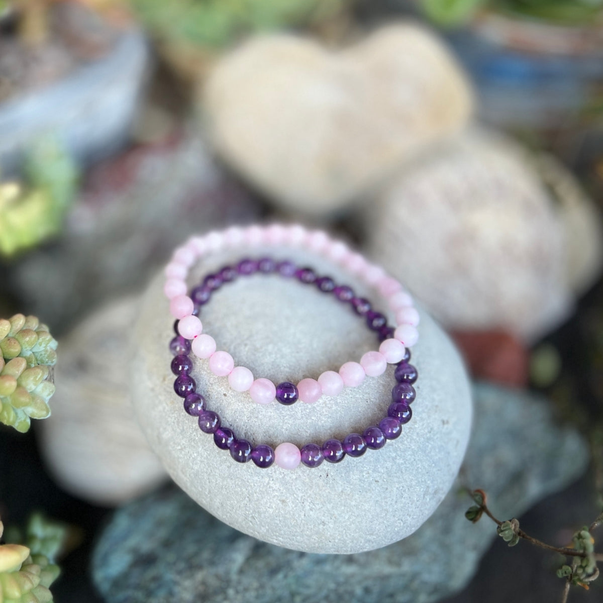 This healing gemstone bracelet pair will have you two lovestruck in a grounded Earthy way.  Spoil yourself and your love with these TWOgether Bracelets! Amethyst and Rose Quartz Bracelet Pair 🖤 🤍 for those couples who prefer less bling and more mindfulness in their lives.    Say "I love you" with this healing gemstone bracelet pair. It connects you two in a special bond.📿❤️
