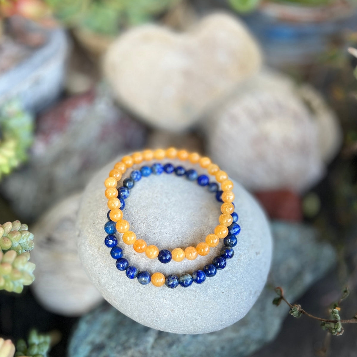This healing gemstone bracelet pair will have you two lovestruck in a grounded Earthy way.  Spoil yourself and your love with these TWOgether Bracelets! Lapis Lazuli and Honey Calcite Bracelet Pair 🖤 🤍 for those couples who prefer less bling and more mindfulness in their lives.    Say "I love you" with this healing gemstone bracelet pair. It connects you two in a special bond.📿❤️