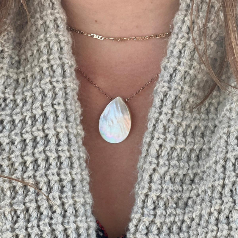 Awakening the Divine Feminine White Abalone Necklace. The Divine Feminine lives within you, within me, within us all. The Divine Feminine is an energy that exists in all living beings on earth, including the ocean, moon, and trees. She is sometimes known as Yin energy, Shakti, Kali, or Gaia.
