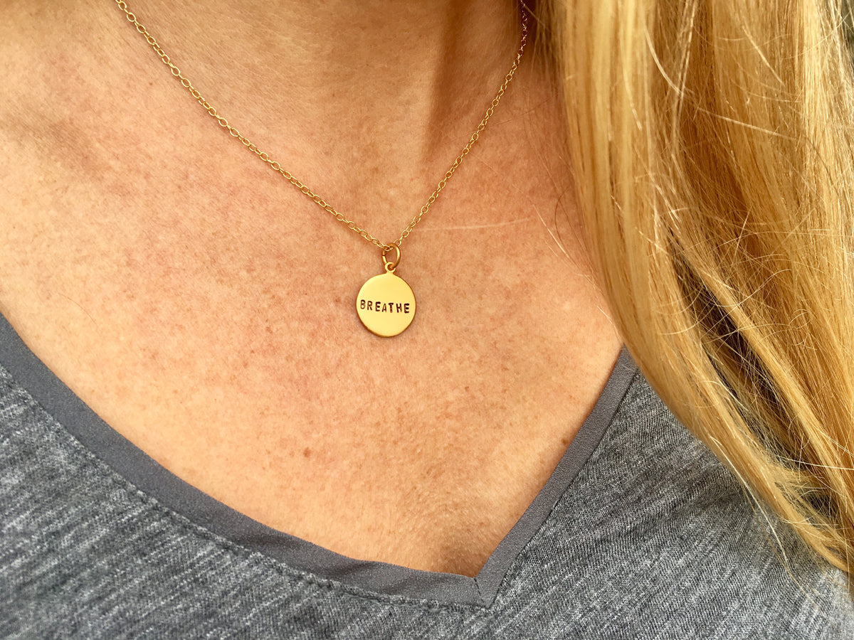 Hand stamped small gold plated BREATHE Necklace for yogis, scuba divers and for those who are just a little too busy, who forget to relax and enjoy the simpler things. 
