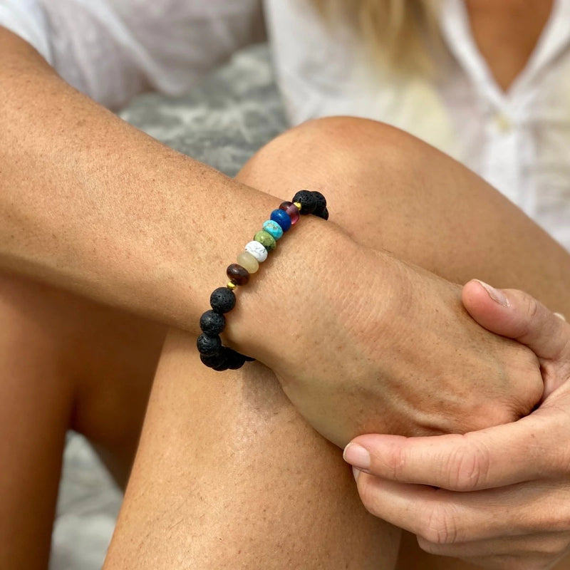 Lava Stone Chakra Bracelet with Healing Gemstones to Release Emotional Baggage. Best gemstones for chakra healing. Now available with Mindful Aromatherapy Mini Balms. Ready, set, relax with the perfect wellbeing ritual.