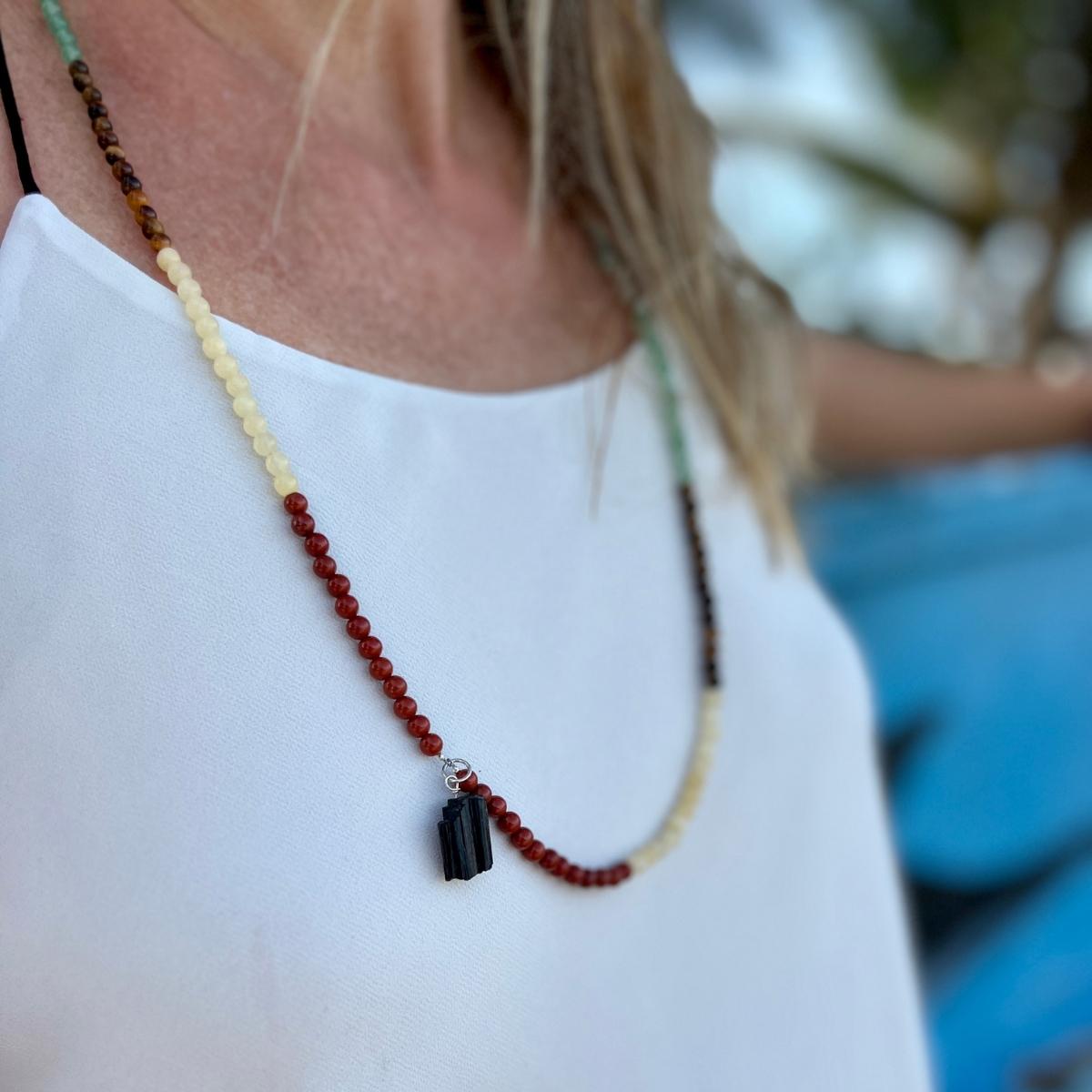 Get the Flowing Energy Chakra Necklace with healing gemstones and feel the balance and harmony of your chakras. 