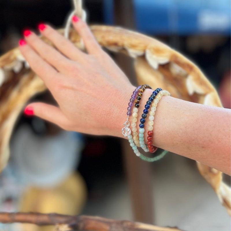 Get the Flowing Energy Chakra Wrap Bracelet with healing gemstones and feel the balance and harmony of your chakras. 