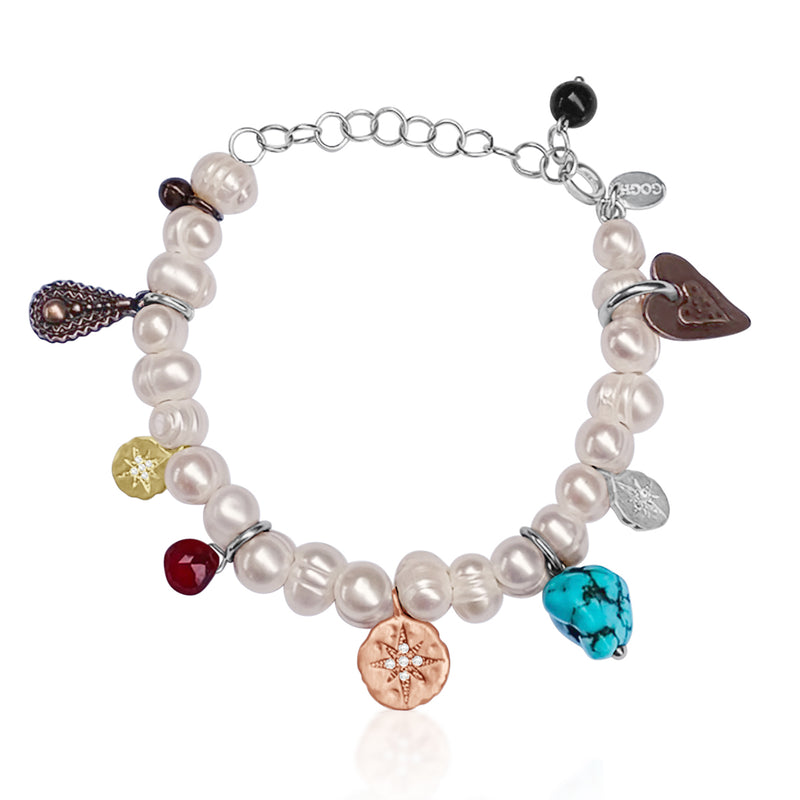 Find Your True North Pearl Bracelet with Silver, Gold, Brass and Rose Gold Charms. Just as a compass points toward a magnetic field, your personal “true north” directs your path and pulls you forward. Pearl is the "Stone of Truth, Faith and Love," enhances personal integrity and helps provide focus.