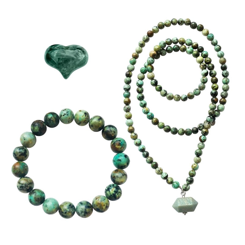 The Self Acceptance African Turquoise Jewelry Set includes:  - African Turquoise Bracelet - African Turquoise Necklace - Moss Agate Heart Shaped Gemstone