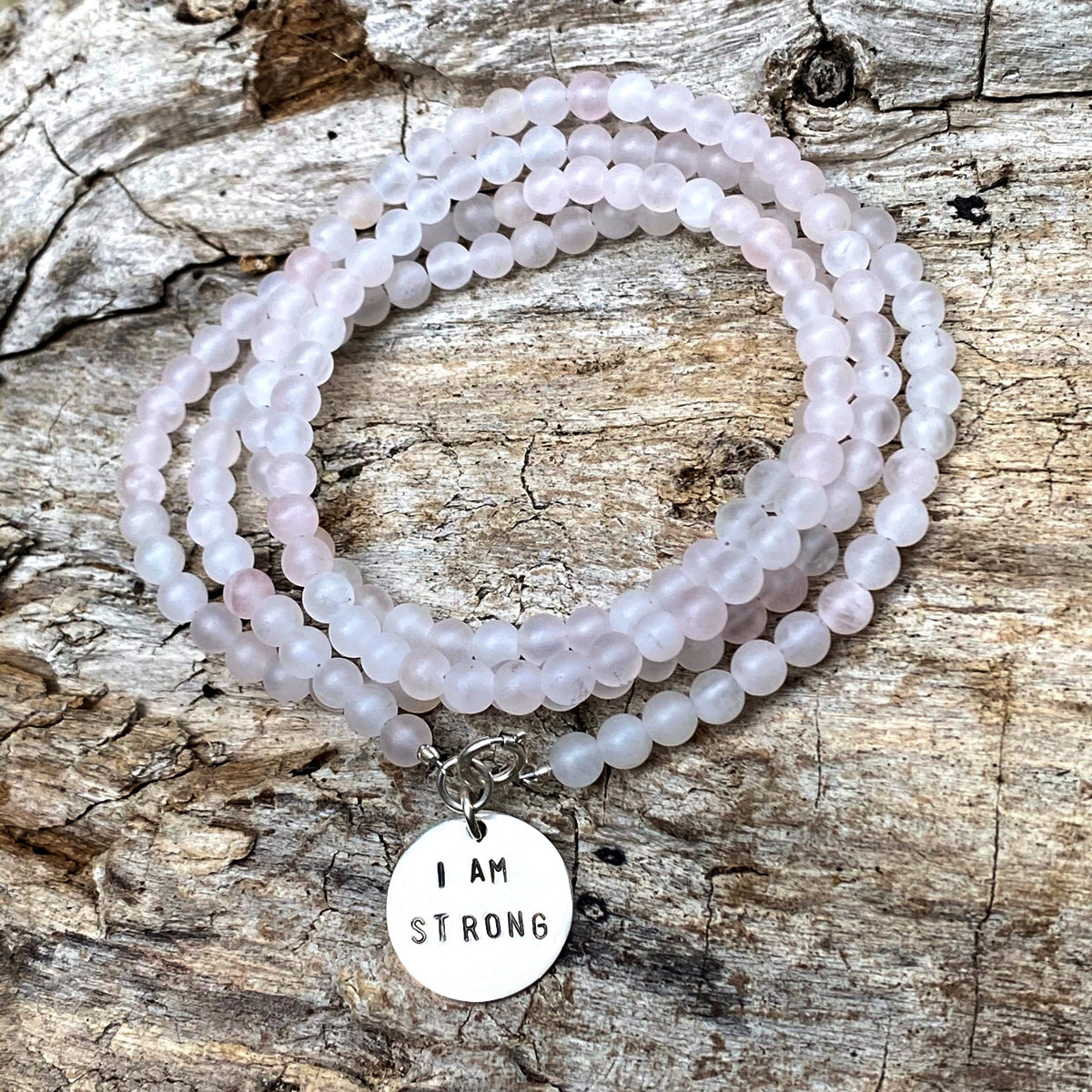 I am Strong Affirmation Bracelet with Rose Quartz to Help Achieve Success. “I am” statements formulate, affirm, and perpetuate the stories you tell yourself. Stories about who you are, who you can be, and what you can do. Every “I am” is true, if you repeat it enough. 