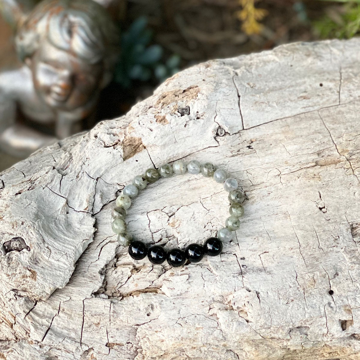 Bracelet for Resilience with Labradorite and Onyx. If you want to channel positive energy and calm your aura this is for you. This makes a great gift for the wholistic healer in your life. If you know someone who loves holistic meditation, crystal healing jewelry, or crystals this energy healing bracelet is perfect.