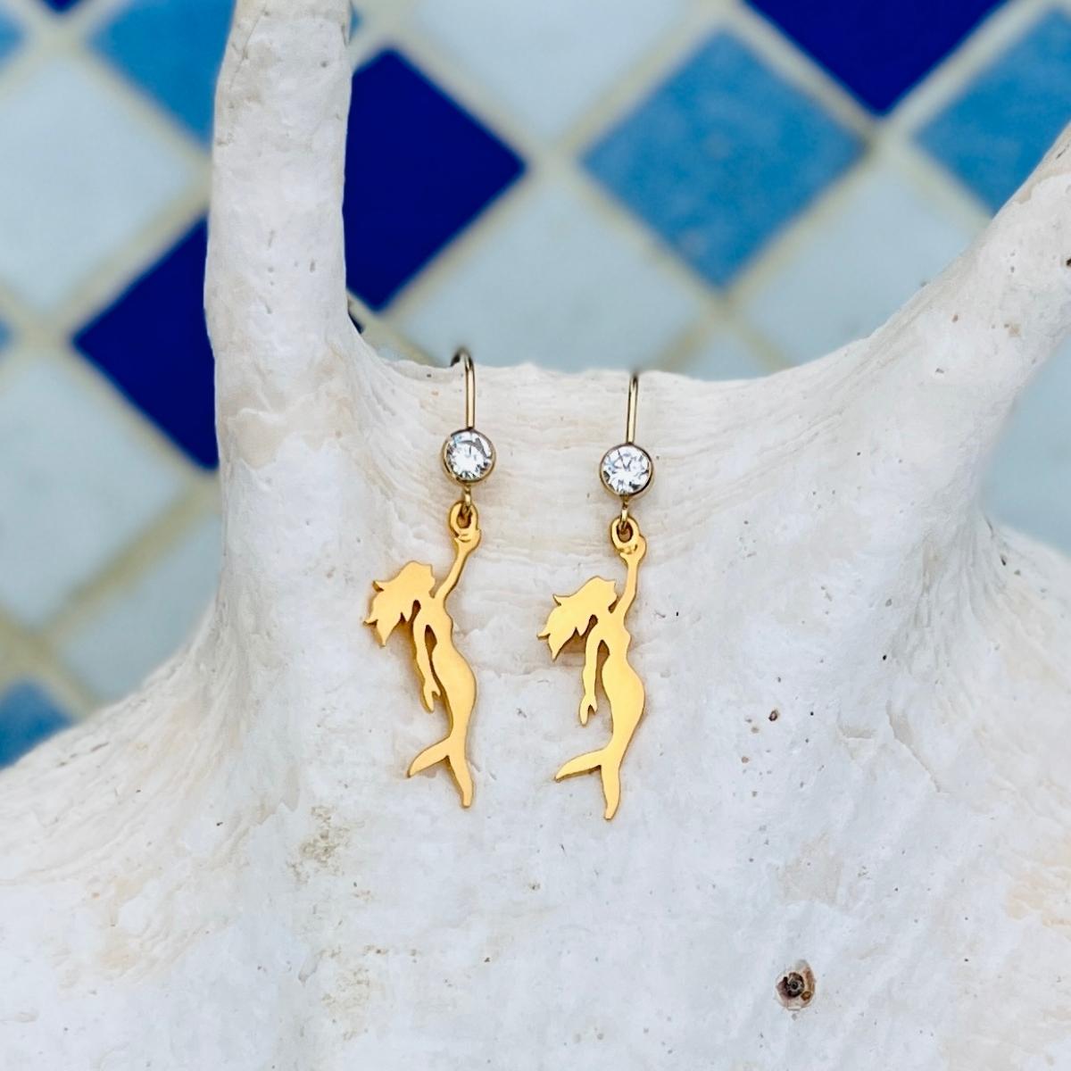 Gold Filled Miss Scuba Mermaid Earrings with Sparkly CZ Crystal This piece reflects Miss Scuba's sense of mystery and individuality, and beckons the free spirit in every self-made women.  Mermaids symbolize Love, Beauty, Mystery, Untamed Spirit and Femininity.