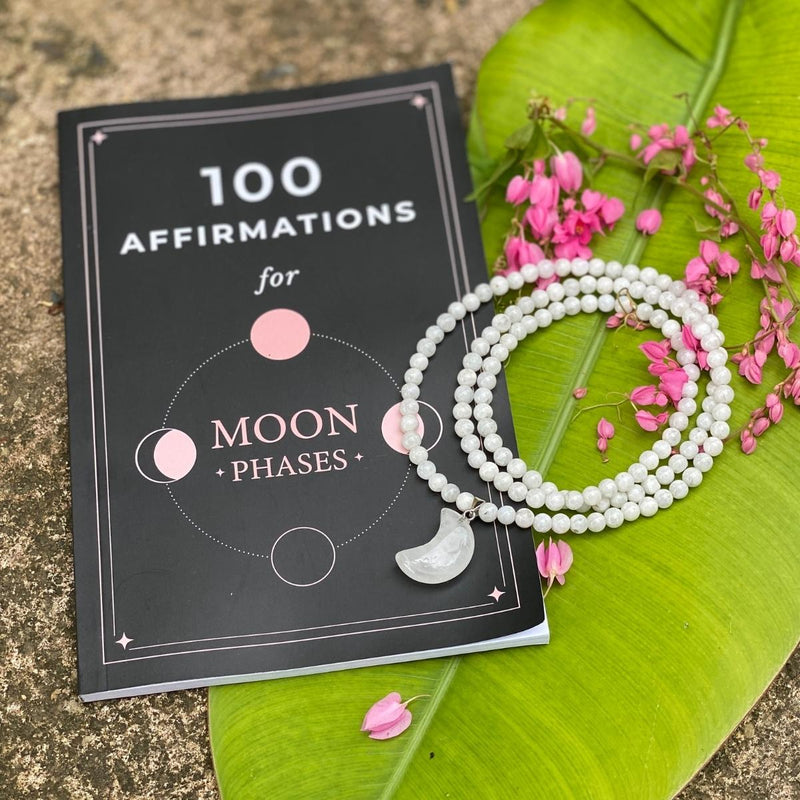 The Shoot for the Moon Jewelry Set includes:  - Moonstone Wrap Bracelet with a Crescent Moon Charm - Moonstone Lunar Energy Necklace for Healing - Clear Crystal Heart Shaped Healing Gemstone