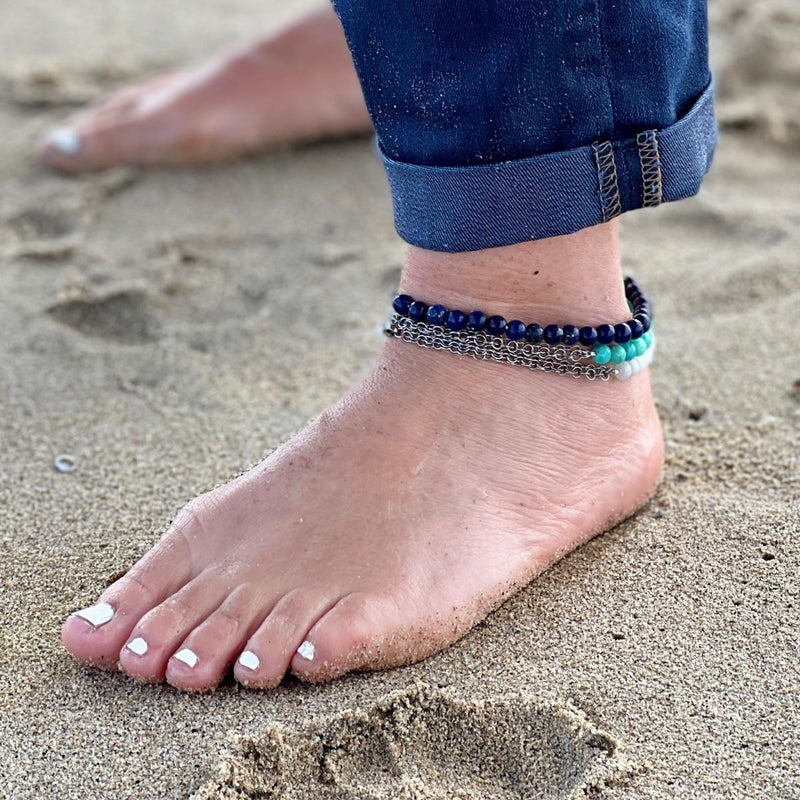 Neptunic SharkSuit Anklet - Sustainable Fashion for Ocean Lovers. Amazonite empowers one to search the self and discover one’s own truths and integrity, and to move beyond fear of judgment. Wear this crystal healing anklet and feel the empowering energies every step you take!