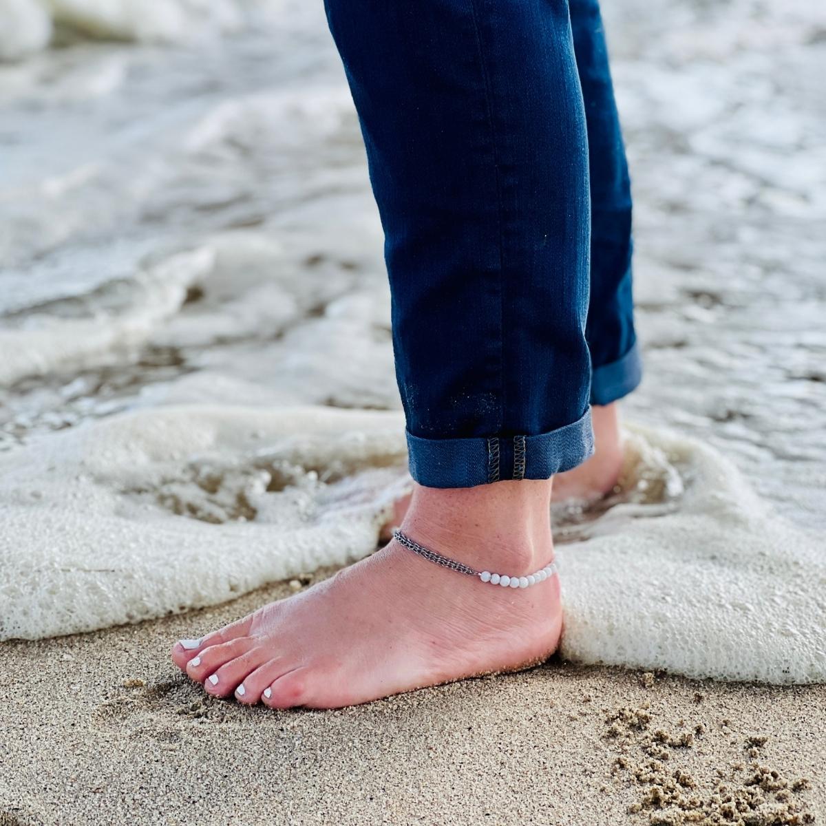 Neptunic SharkSuit Anklet - Sustainable Fashion for Ocean Lovers. People of the Water is dedicated to changing people's relationship with our aquatic world through Exploration, Education, and Conservation. Portions of the sale of this jewelry supports the People of the Water Non-Profit.