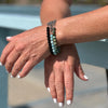 Neptunic SharkSuit Bracelet Stack with African Turquoise, Amazonite and Onyx - Sustainable Fashion for Ocean Lovers. Neptunic loved Szilvia Gogh's Zero Waste Project (upcycled jewelry made of used scuba gear) parts and asked her to repurpose their chainmail accumulated during Sharksuit fabrication, into gorgeous pieces of handcrafted sustainable jewelry. 