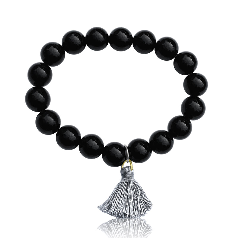 Onyx Bracelet with Tassle to Remind Us that Our Shadows are Parts of Us. Unisex Black Onyx Bracelet for Self-Control. Onyx helps one have self-control and anchors one’s flighty energy. Black, usually a color of “darkness” Onyx remind wearers that  shadows are parts of us, and that we ALL have them. 