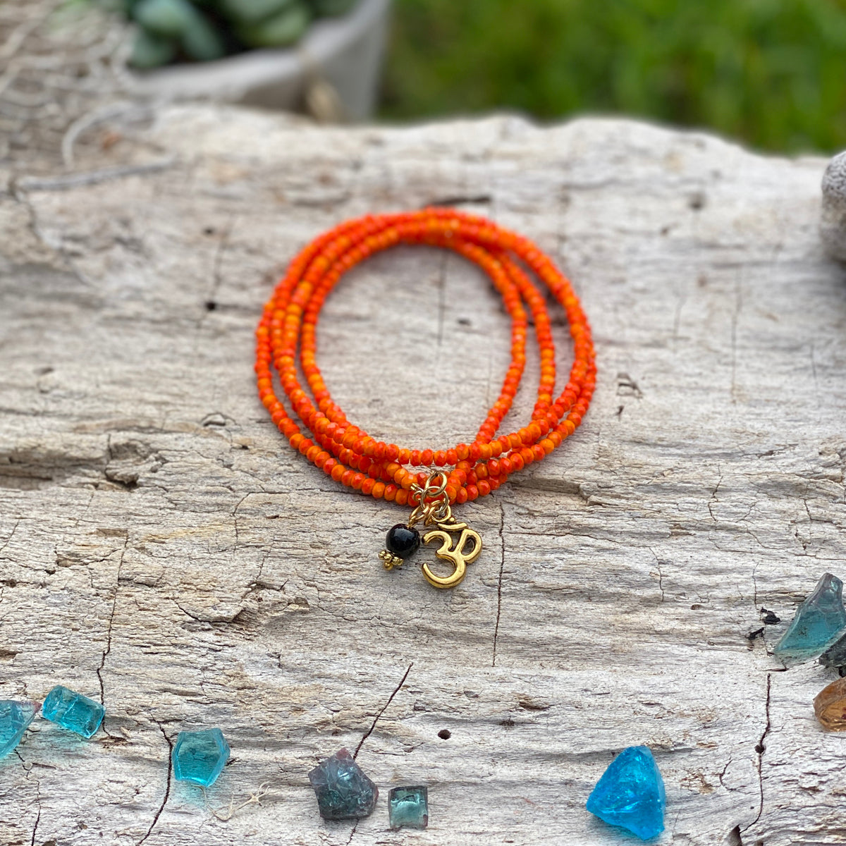 Orange Crystal Wrap Bracelet for Creativity with Ohm and Onyx Charms 