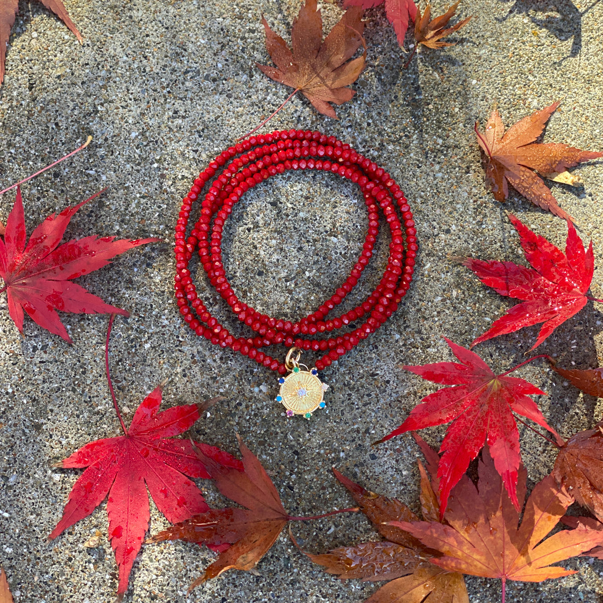 Burgundy Red Crystal Wrap Bracelet with The Medicine Wheel to Restore Harmony in Your Life. The Medicine Wheel is an ancient Indian practice of balance and harmony within the Four Directions. A Healing Journey that can restore Wholeness and Connection to Ourselves and to the World.