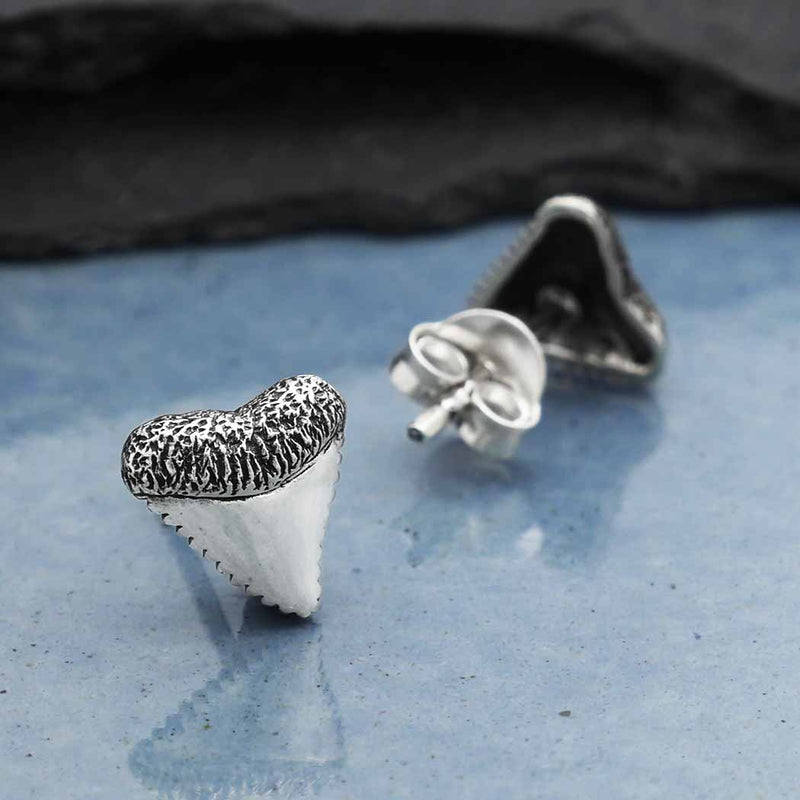 These sterling silver shark tooth post earrings are more than just a fashion statement for beach lovers and surfers. They are also amulets of protection, believed to bring good fortune and ward away evil spirits. According to Hawaiian legends, a young warrior wore shark teeth jewelry after diving into the sea and defeating sea gods.