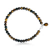 Enduring Patience - Tiger Eye Anklet   Think of the qualities of the Tiger. Patient, focused, determined, alert, with perfect timing and slow, deliberate action. This is Tiger Eye’s gift to you.