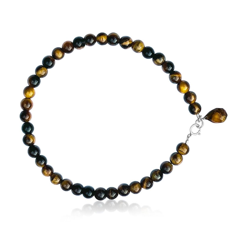 Enduring Patience - Tiger Eye Anklet   Think of the qualities of the Tiger. Patient, focused, determined, alert, with perfect timing and slow, deliberate action. This is Tiger Eye’s gift to you.