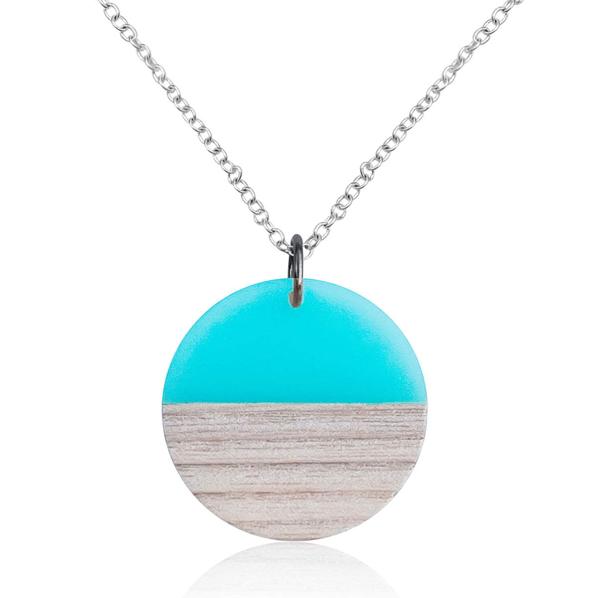 This stunning Coastal Horizon Necklace features a round pendant made of wood and turquoise blue resin, reminiscent of the sand and ocean. This Coastal Horizon Necklace helps you stay in that Endless Summer mindset all year around. 