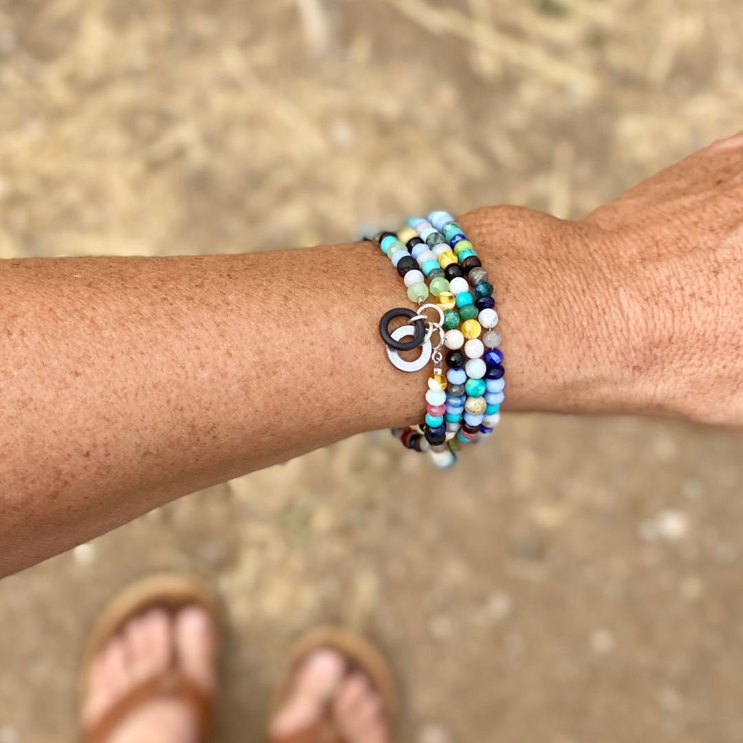Zero Waste Eco Conscious Wrap Bracelet with Up-recycled scuba gear parts and Gemstones. Influenced by those artists and organizations that up-recycle fishing nets into bathing suits from ocean trash, I found ways to reuse and repurpose old SCUBA gear parts to create sustainable jewelry.